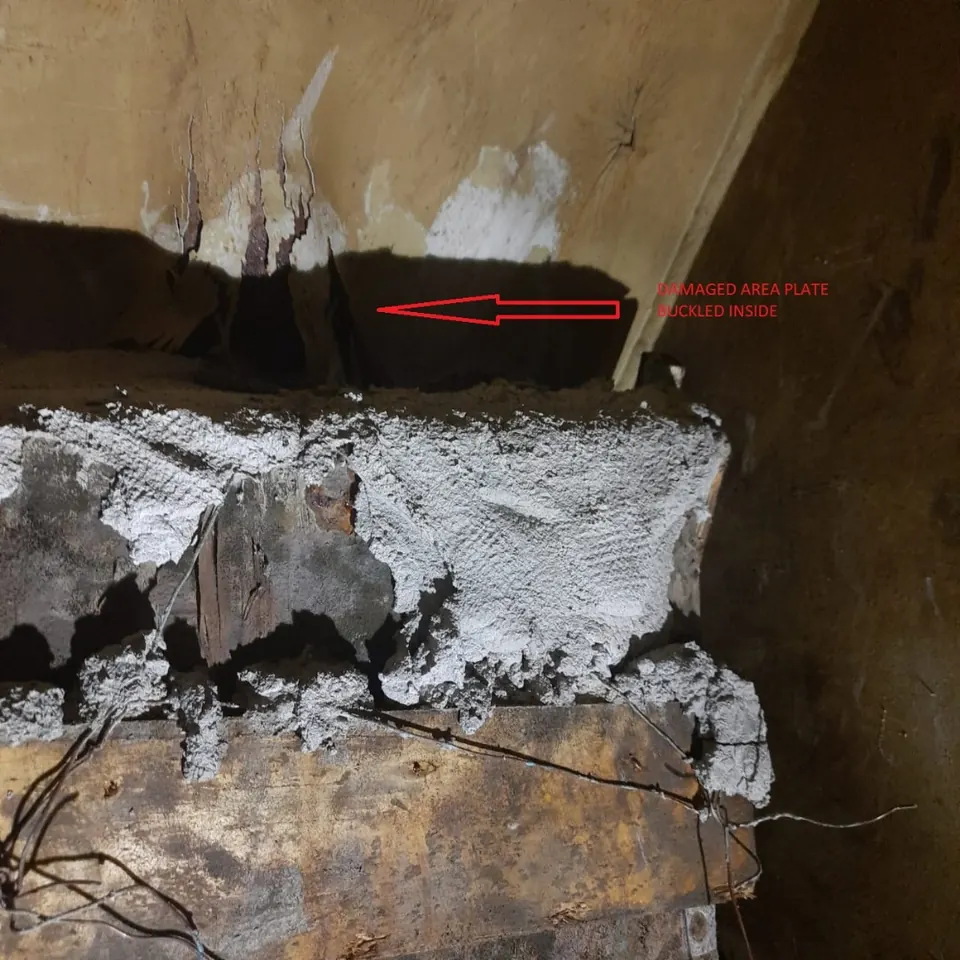 Steel structure repair area marked for welding
